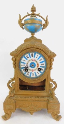 A 19thC French gilt metal and enamelled clock garniture, the white enamel circular dial bearing Roman numerals interspersed with blue sections, floral decoration and gilt highlights, the case surmounted by a porcelain and gilt metal urn, the case elaborat - 3