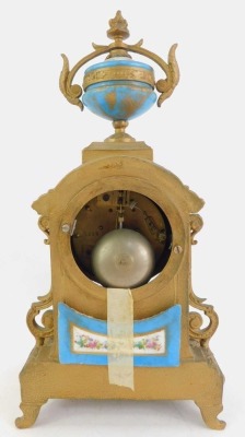 A 19thC French gilt metal and enamelled clock garniture, the white enamel circular dial bearing Roman numerals interspersed with blue sections, floral decoration and gilt highlights, the case surmounted by a porcelain and gilt metal urn, the case elaborat - 5