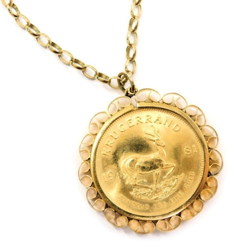 A 1981 gold krugerrand, with 9ct gold pendant mount and chain, 48.5g all in.