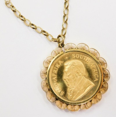 A 1981 gold krugerrand, with 9ct gold pendant mount and chain, 48.5g all in. - 2