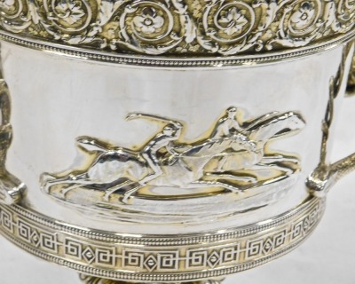 A George III Garrard silver two handled horse racing trophy and cover, the lid with a horse finial, the base with foliate and geometric bands, serpent handles and cast with horses in relief opposing a vacant cartouche, engraved to base Garrard, Panton Str - 3