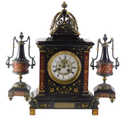 A late 19thC French black slate, marble and bronze clock garniture by HY Marc of Paris, the clock case decorated with scrolls, berries, beads, etc., the white enamel dial with Roman numerals, on block feet headed by grotesque masks flanked by a pair of tw