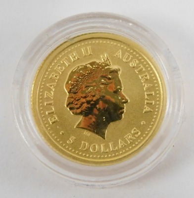 A one twentieth ounce Australian nugget, dated 2000, in Westminster pouch. - 2