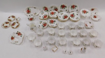 A large quantity of Royal Albert Poinsettia pattern teaware, etc. - 2