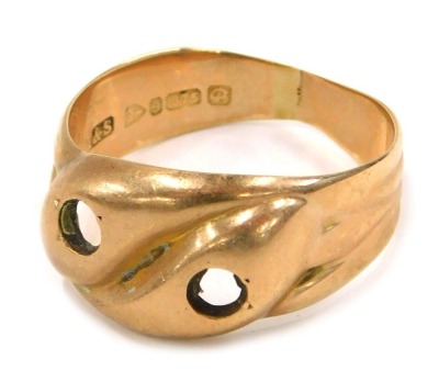 A 9ct rose gold snake ring, the cross over head, lacking stones, maker T&S, Chester 1929, ring size V, 5.6g.