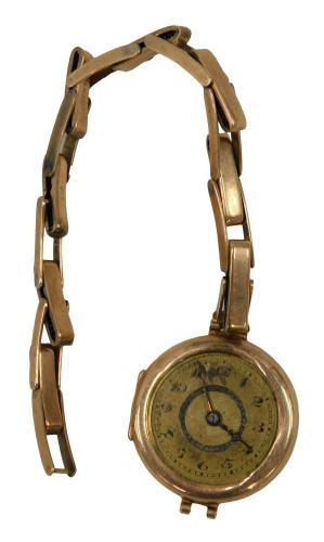 A 1940s/50s wristwatch, the circular numeric silvered dial, in a yellow metal case, on expanding bracelet, both stamped 9ct, the dial 2.5cm wide, 17.6g all in. (AF)