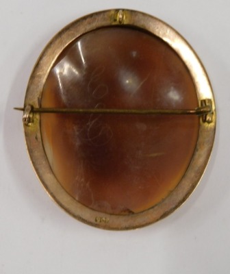 A 19thC shell cameo brooch, the cameo in raised relief depicting deer, bridge and trees, in a rope twist rub over border, on single pin back stamped 9ct, 5cm x 4.5cm, 13.1g all in. - 2