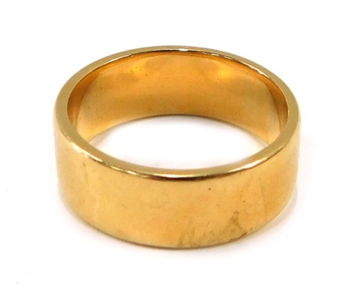 An 18ct gold wedding band, of plain design, maker WW, 9mm width, London 1953, ring size W½, 13.3g.