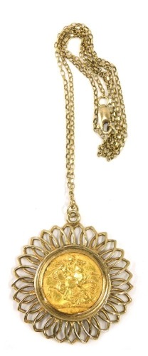 A George V full gold sovereign pendant, dated 1912, in a yellow metal sunflower frame, stamped 375, the pendant 4cm high, on fine link neck chain stamped 375, 44cm long, 15.1g all in.