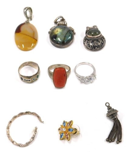 A group of silver and other costume jewellery, comprising Eastern inspired pendant, white metal stamped 925, three white metal dress rings stamped 925, single hoop earring, and a costume earring. (a quantity)