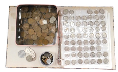 A collection of pre-decimal coinage, comprising a tin of pennies and half pennies, an album containing florins, shillings, etc. (2)