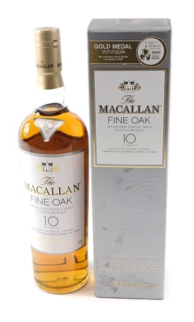 A bottle of The Macallan Fine Oak Highland Single Malt Scotch Whisky, aged 10 years, in original box and packaging.