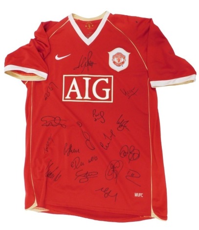 A Manchester United shirt, bearing signatures, with World Son certificate of authenticity dated 2007.