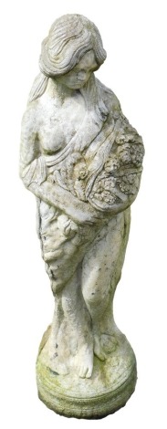 A reconstituted stone figure, of a lady carrying basket of flowers, on circular foot, 80cm high.