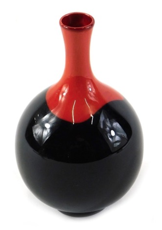 A Royal Doulton Flambe bottle shaped vase, in red and black, printed marks in black to underside, 11cm high.