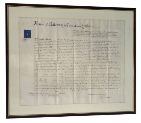 An 18thC indenture, for the Manor or Netherbury, stamped Beaminster 1064, 47cm x 60cm, framed and glazed.