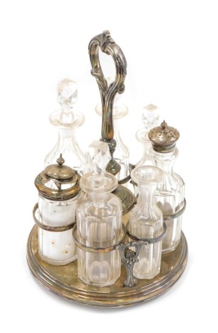 A silver plated seven bottle cruet, 30cm high. (AF)