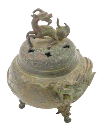 A bronze incense burner, with dragon motif, with rubbed character stamp to underside, 13cm high.