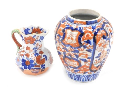 A Japanese Imari vase, of globular form, 15cm high, and a Mason's Imari pattern miniature jug, 9cm high. (2)