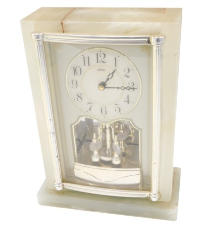 A Seiko Emblem onyx mantel clock, the reeded stem on a white numeric dial, 27cm high, 18cm wide, 9cm deep.