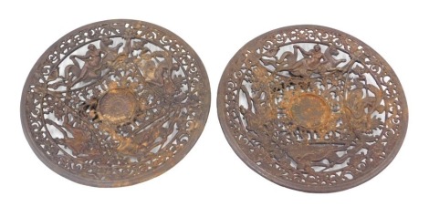 A pair of Coalbrookdale style chargers, each depicting semi-clad females riding on horses and scroll border, 22cm diameter.