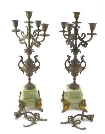 A pair of late 19thC French spelter and onyx candelabra, each decorated with scrolls, and with a bronzed finish, 54cm high. (AF)