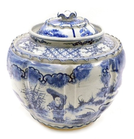 A modern Chinese blue and white jar and cover, of lobed form with wavy border, 34cm diameter.