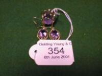 A modern 9ct gold amethyst set ring and a pair of amethyst set drop earrings