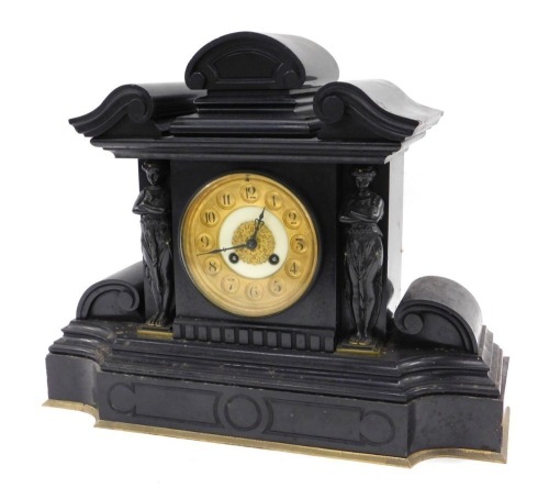 A French black slate mantel clock, of architectural form, with bronze caryatids, 36cm high.