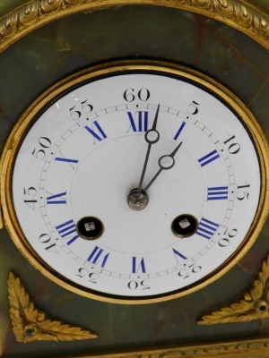 A late 19thC French onyx and gilt metal Pendule D'fficeur, the white enamel dial with blue Roman numerals, the case embellished with reeds, leaves, etc., on bun feet, 29cm high. - 2