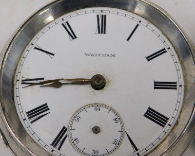 Three silver pocket watches, comprising a Waltham 19thC pocket watch, with white enamel Roman numeric dial and key wind, with rubbed hall marks, a further example with vacant cartouche to shield, London 1861, the movement numbered 46440, and a John J Dent - 2