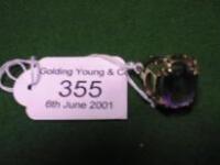 A modern amethyst set ring in yellow metal stamped 333