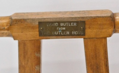 A 20thC beech boot jack, with presentation plaque David Butler from The Butler Boys, 80cm high. - 2