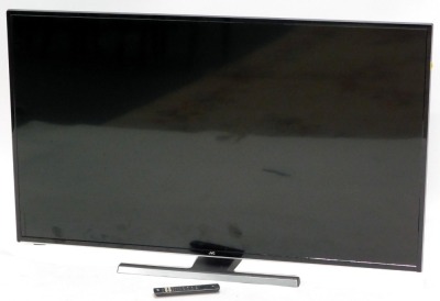 A JVC 50" television, with remote. (remote AF)