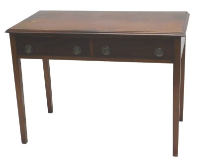 A mahogany side table in George III style, the rectangular top with a moulded edge above two frieze drawers, on square tapering legs, 78cm high, 107cm wide.