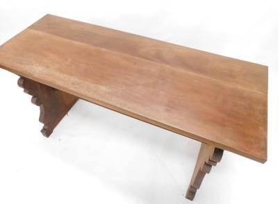 A walnut refectory style side table, with a rectangular planked top on shaped end supports, with stretcher, possibly Spanish, 74.5cm high, the top 138cm wide, 52cm deep. - 2