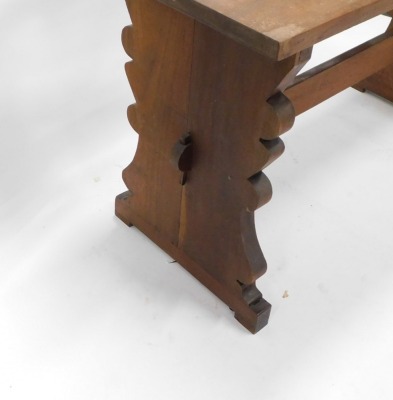 A walnut refectory style side table, with a rectangular planked top on shaped end supports, with stretcher, possibly Spanish, 74.5cm high, the top 138cm wide, 52cm deep. - 3