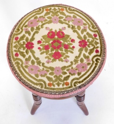 A late Victorian walnut adjustable piano stool, with a padded seat, on turned legs. - 2