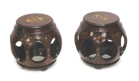 A pair of Eastern hardwood brass and copper inlaid barrel shaped drum stools, 44cm high.