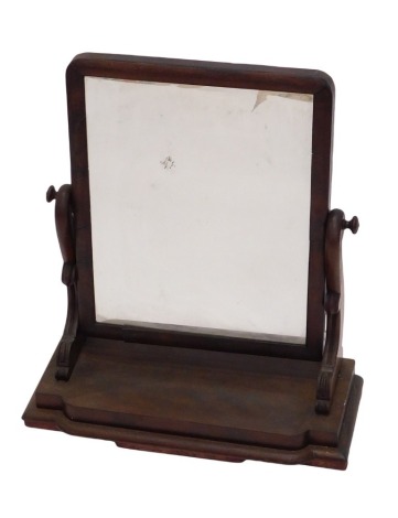 A Victorian mahogany swing framed dressing table mirror, on shaped supports with bow fronted base, 60cm wide.