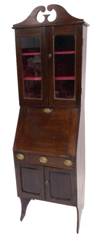 An early 20thC narrow bureau bookcase, the top with a swan neck pediment with two glazed doors, the base with a fall enclosing a fitted interior above three drawers, two panelled doors, on end supports, 182cm high, 52cm wide.