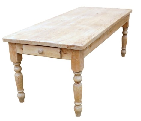 A Victorian style pine kitchen table, the rectangular top on turned legs with frieze drawer, 78cm high, the top 90cm x 213cm.