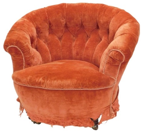 A Victorian mahogany tub shaped chair, with button padded back and seat, on turned legs with castors. (AF)