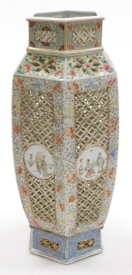 A Qing dynasty late 19thC Chinese famille rose pierced porcelain lantern, of shouldered hexagonal form, with reticulated and painted decoration, having circular reserves with figures, on a floral ground, later converted to a table lamp, bears traces of a - 4