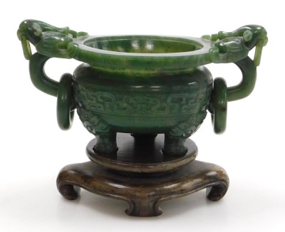 A Chinese spinach jade censer, with twin bird head and ring handles, carved with a band of stylised dragons, raised on three dog of fo shaped feet, boxed, 15.5cm wide. - 3