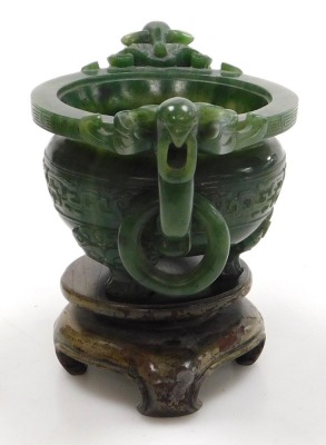 A Chinese spinach jade censer, with twin bird head and ring handles, carved with a band of stylised dragons, raised on three dog of fo shaped feet, boxed, 15.5cm wide. - 4