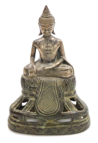 A Cambodian bronze figure, of a seated Buddha, raised on a pierced and engraved base, 15cm high.