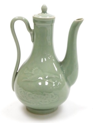 A Chinese celadon glazed ewer and cover, of pear shape, the body incised with cranes and clouds, 21.5cm high. - 3