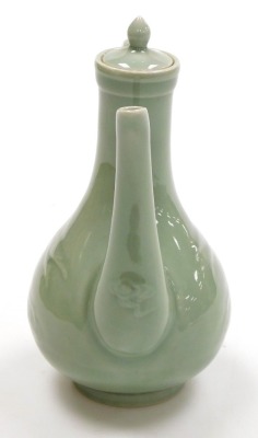 A Chinese celadon glazed ewer and cover, of pear shape, the body incised with cranes and clouds, 21.5cm high. - 4