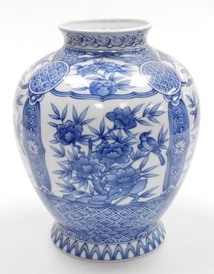 A Japanese porcelain globular blue and white vase, on flared foot, decorated with panels of flowers within geometric and floral borders, with four character mark to base, 20th century, 28cm high. - 2